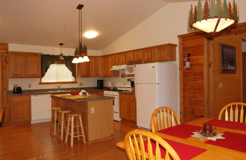 Cabin kitchen and dining room at Warrens Lodging.