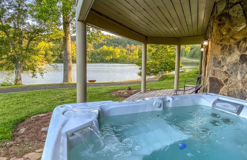 Rental hot tub at Mountain Oasis Cabin Rentals.