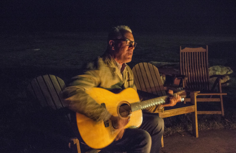 Singing around campfire at Castle Valley Outdoors.