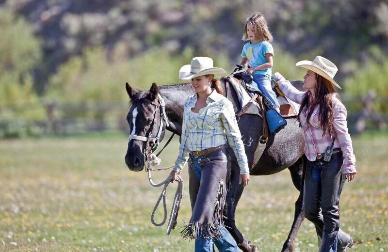 Family horseback riding at Goosewing Ranch.