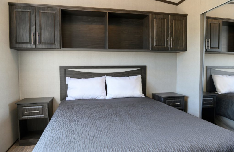 Cottage bedroom at Great Blue Resorts- Cherry Beach Resort.