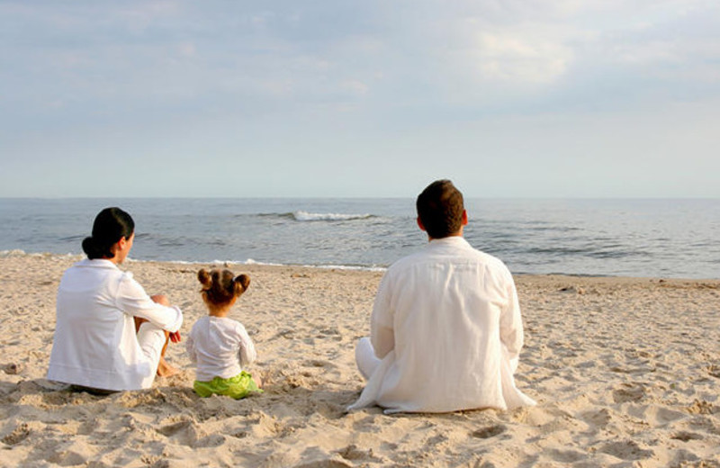 Family on beach at Ramada Plaza.