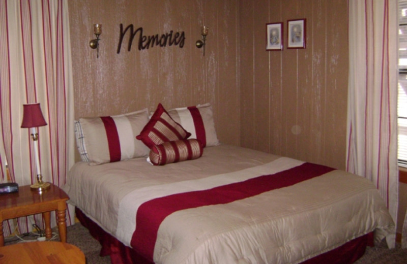 Cabin bedroom at Pine Lodge Cabins & Suites.