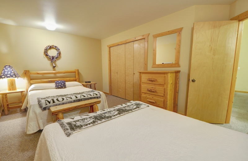 One of the bedrooms in our 2 bedroom cabin. Our 2 bedroom cabin can actually sleep 10 guests comfortably.  There are two queen beds in each room with an additional pullout queen in the living room. Located just 1/2 mile from Glacier National Park