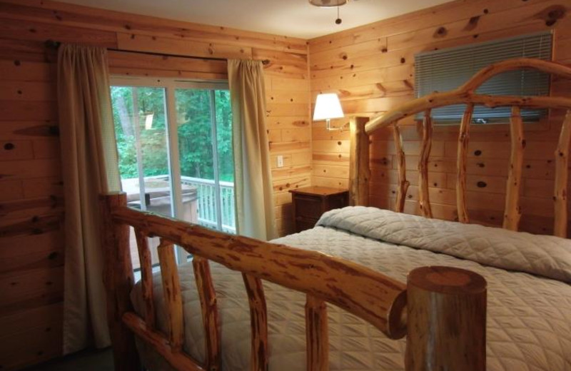 Cabin bedroom at Acorn Hill Resort.