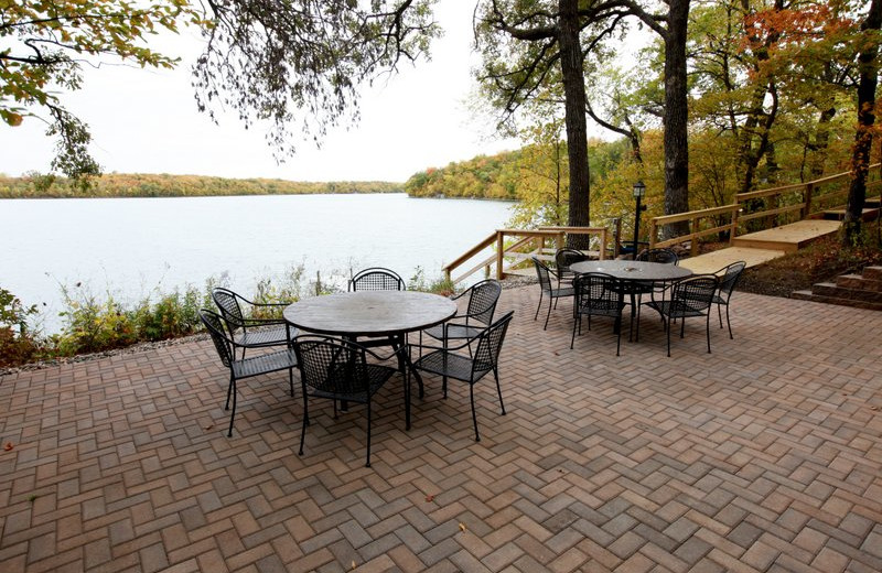 Patio with table and chairs by the lake at East Silent Resort.