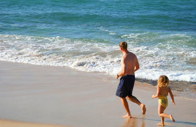 Family on the beach at Maui Vacation Rentals.