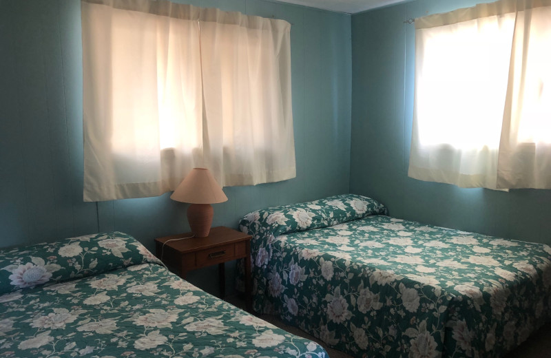 Cabin bedroom at Dogtooth Lake Resort.