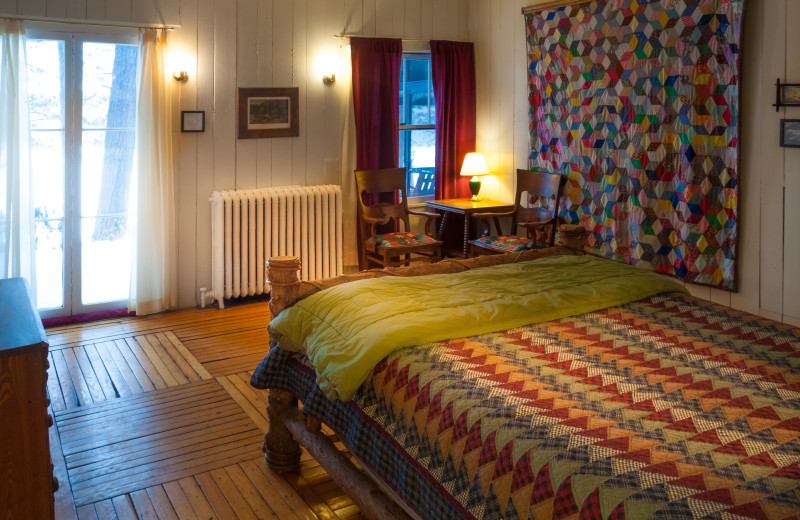 Cabin bedroom at White Pine Camp.