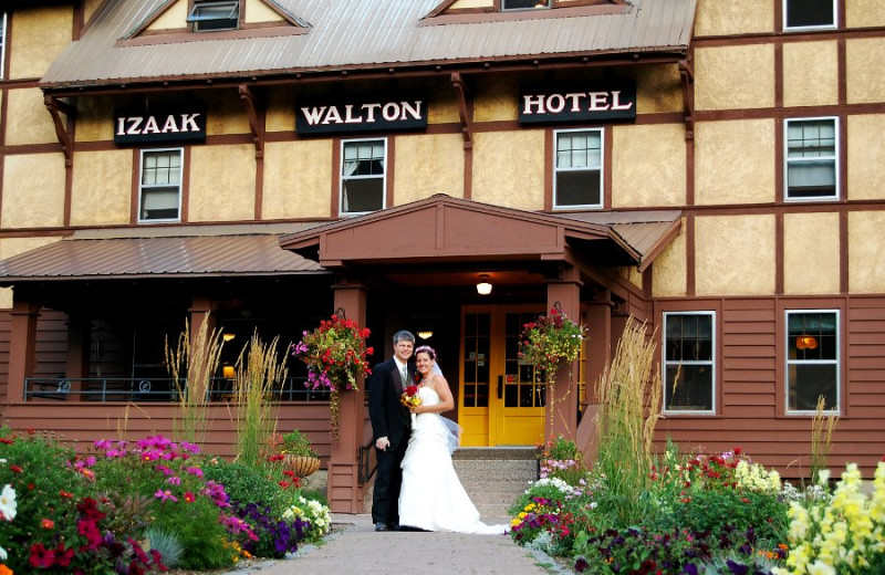 Wedding couple in front of Izaak Walton Inn.