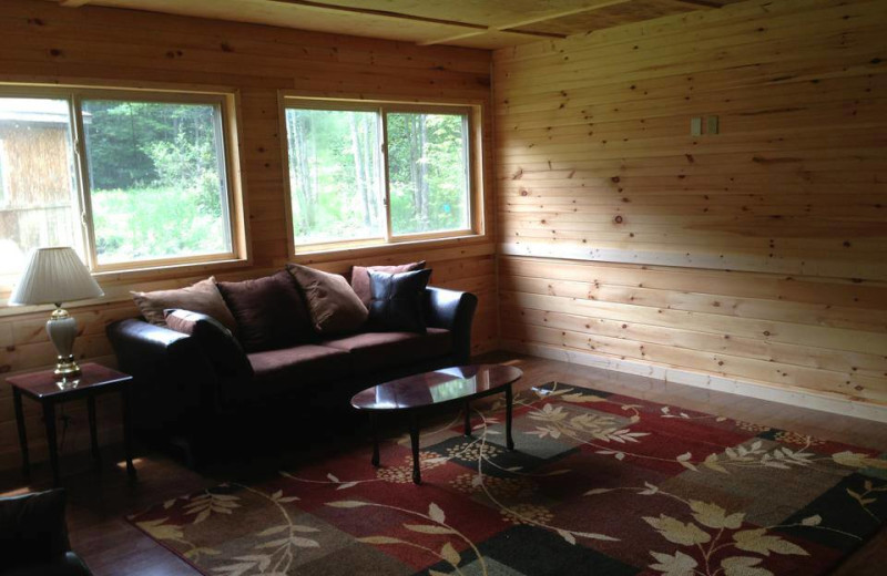 Cabin living room at The Woods At Bear Creek Glamping Resort.