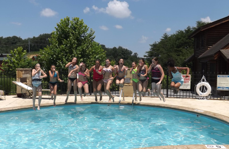 Jumping in the pool at Golfview Vacation Rentals.