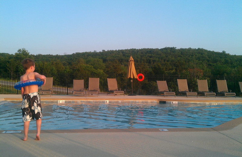 Kid by pool at Vacation Home in Branson.