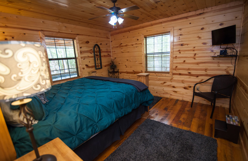 Cabin bedroom at Kiamichi Country Cabins.