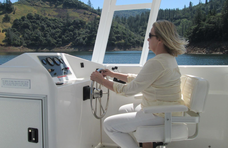 Driving the houseboat at Lake Oroville.