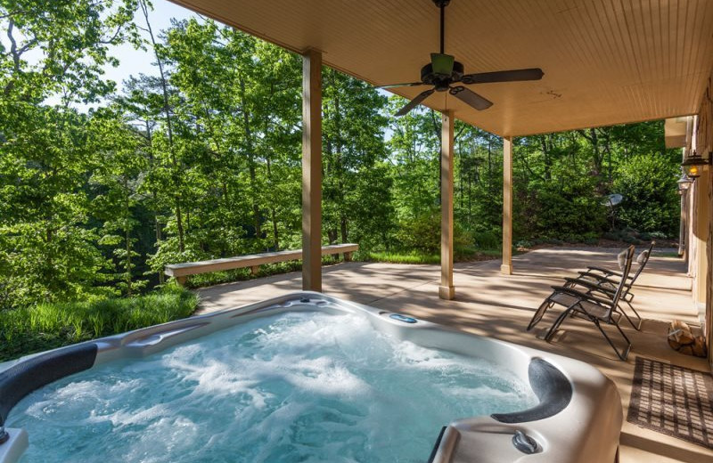 Cabin hot tub at Mountain Oasis Cabin Rentals.