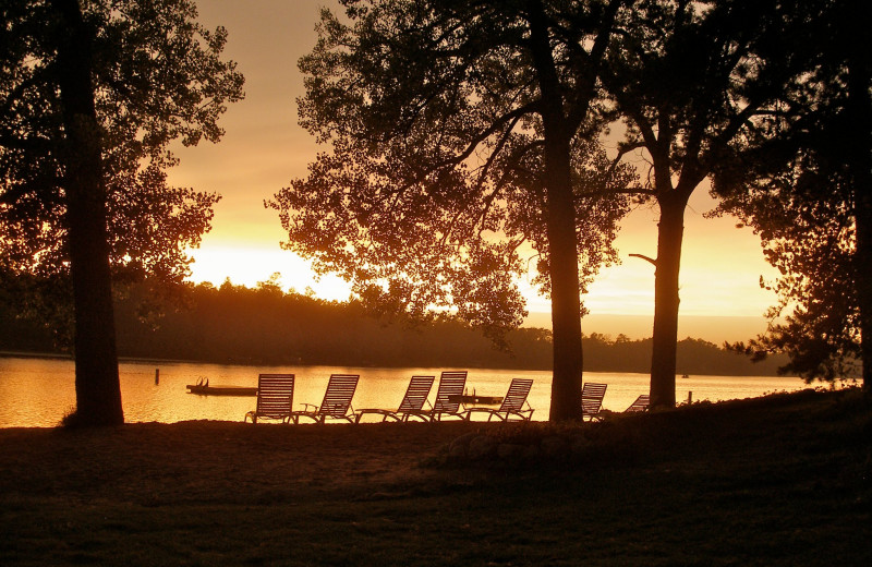 Beach sunset at Breezy Point Resort on Straight Lake.