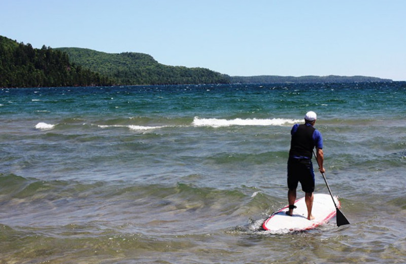 Paddle board at Aqua Log Cabin Resort.