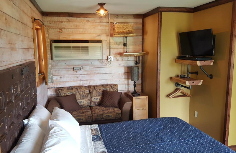 Cabin bedroom at Arkansas White River Cabins.