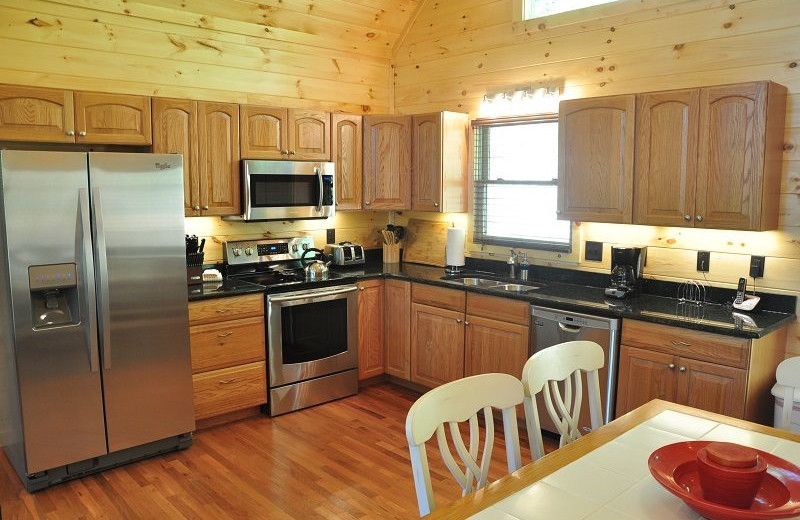 Cabin kitchen at Great Smokys Cabin Rentals.