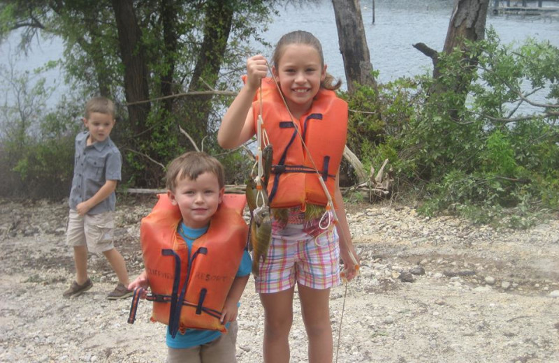 Kids with fish at Cliffview Resort.