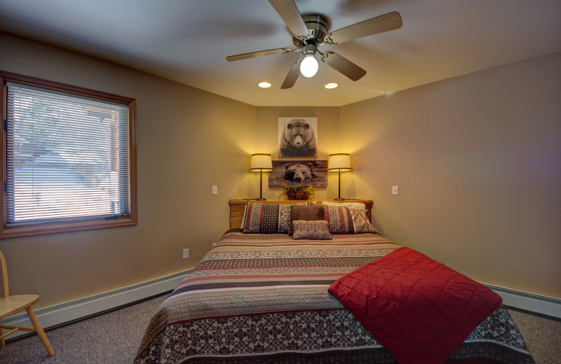 Cabin bedroom at River Stone Resorts & Bear Paw Suites.