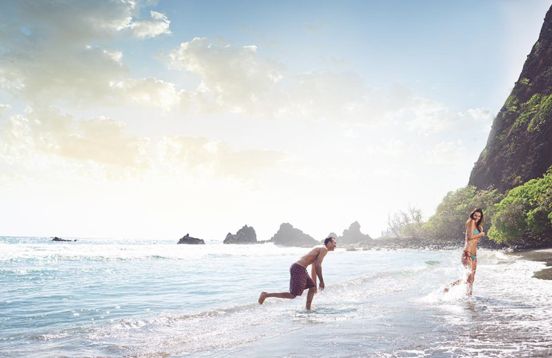 Couple on beach at Travaasa Hana, Maui.