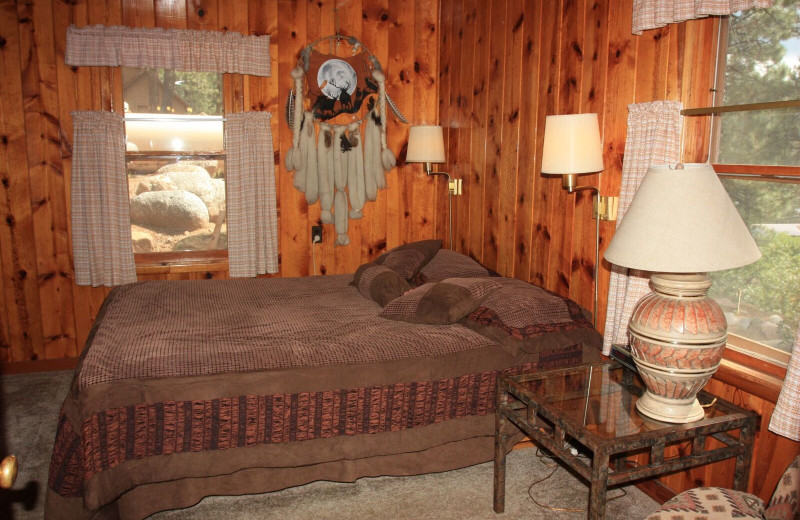 Cabin bedroom at Pine River Lodge.