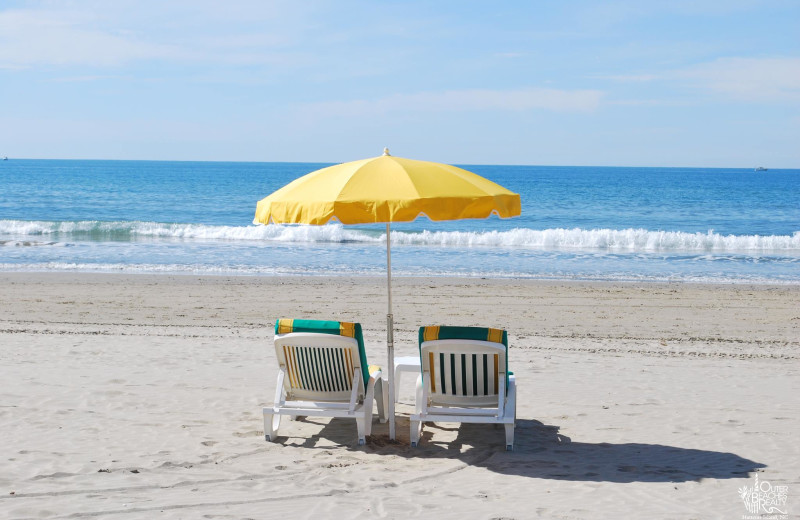 Relax on the beach at Outer Beaches Realty.