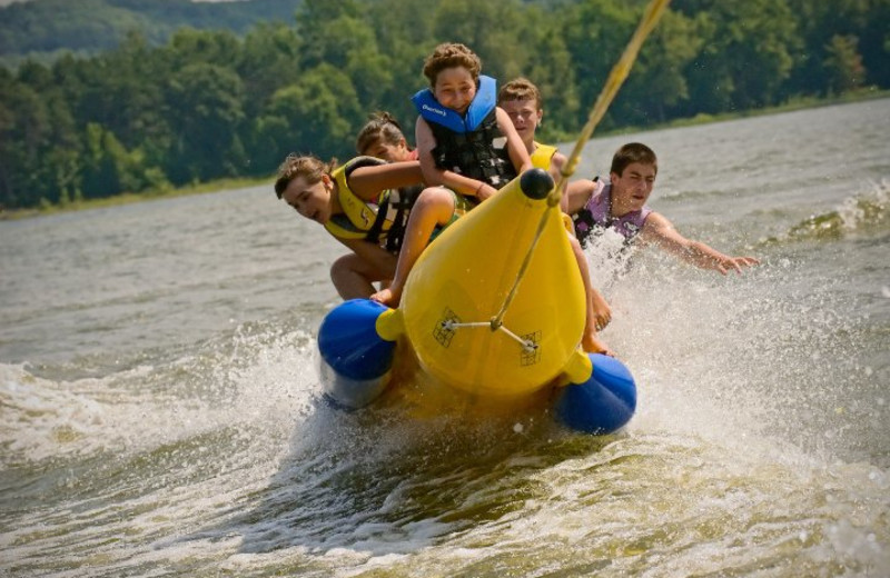 Family riding the banana boat at The Tyler Place Family Resort.