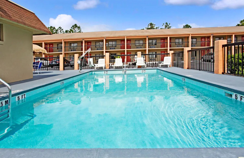 Outdoor pool at Super 8 by Wyndham Kissimmee/Maingate/Orlando Area.