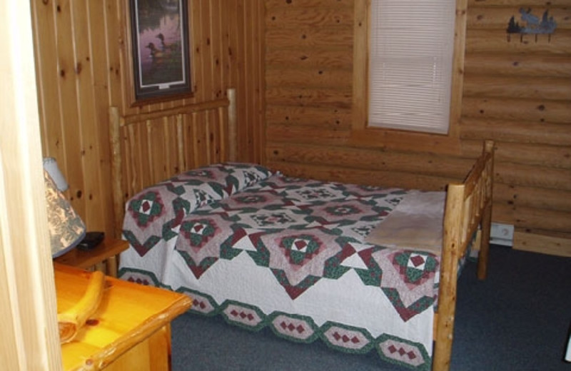 Cabin bedroom at Timber Trail Lodge & Resort.