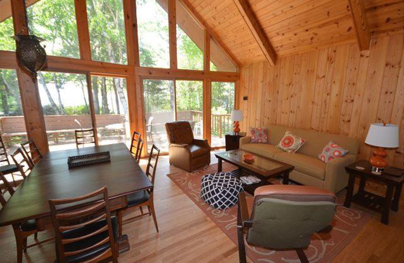 Rental living and dining room at Visit Up North Vacation Rentals.