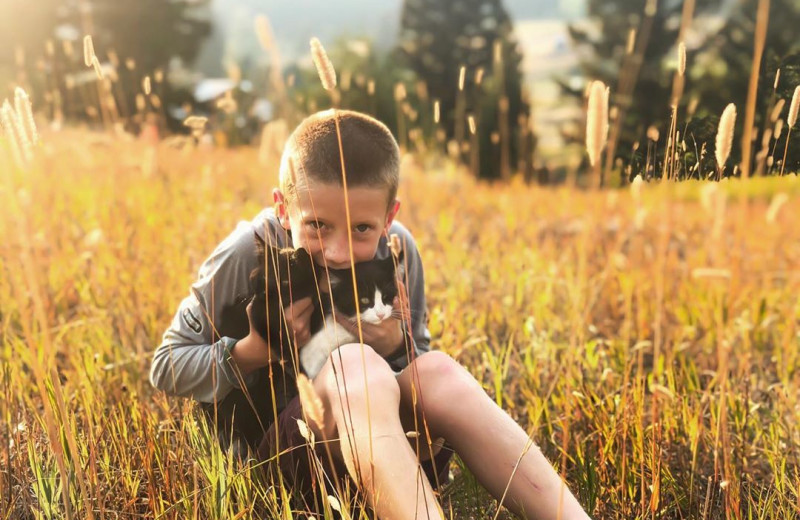 Child and cat at Hardscabble Ranch.