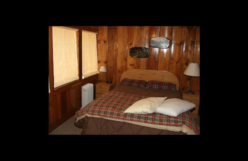 Cottage bedroom at Watson's Harverene Resort.