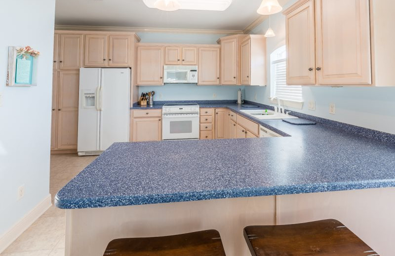 Rental kitchen at Luxury Properties Vacation Rentals.