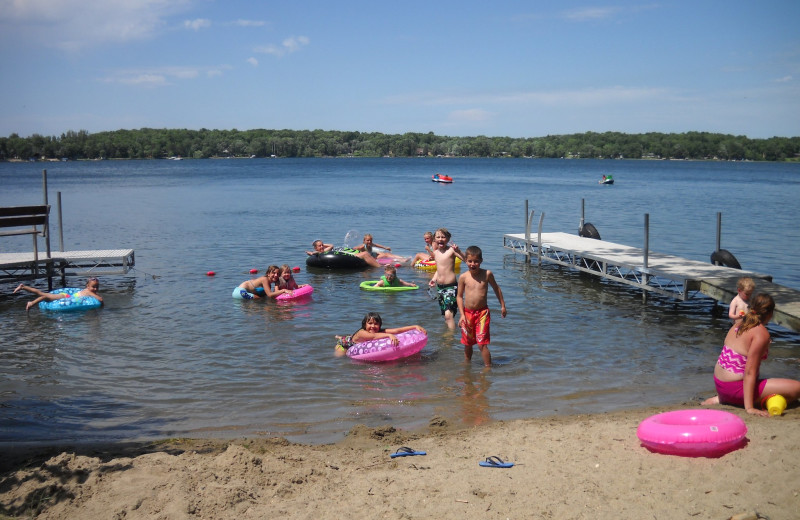 Swimming at the beach at Cozy Cove Resort.