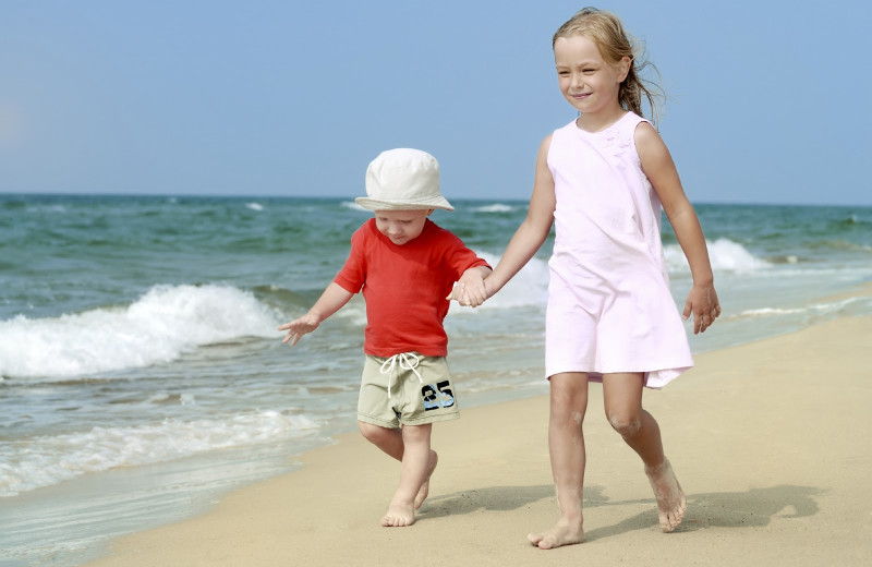 Family on the beach at Gold Key Resorts.