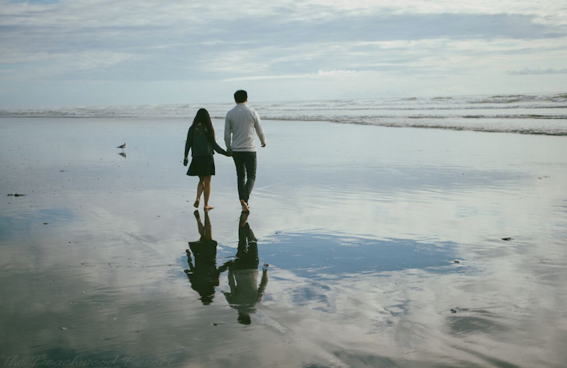 Walking on the beach at Beachwood Condos & Resort.