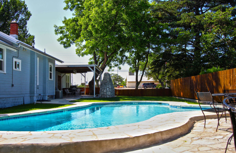 Outdoor pool at Peach Tree Inn & Suites.