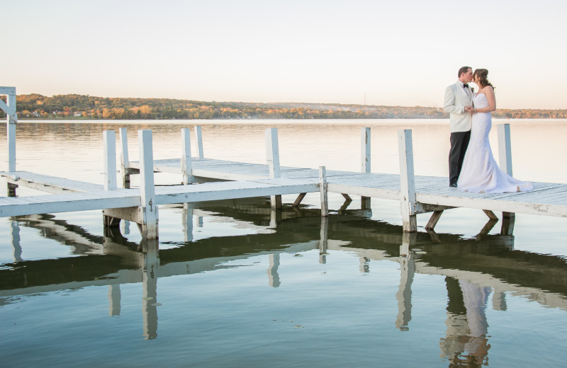 Wedding couple on dock at The Ridge Hotel.
