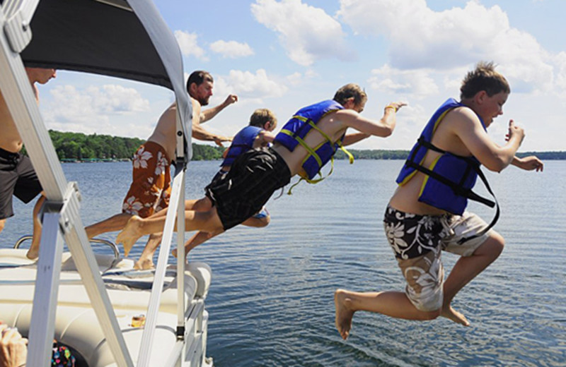 Jumping in lake at Cragun's Resort and Hotel on Gull Lake.