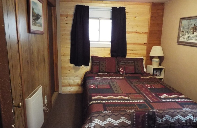 Cabin bedroom at Rustic River Cabins.