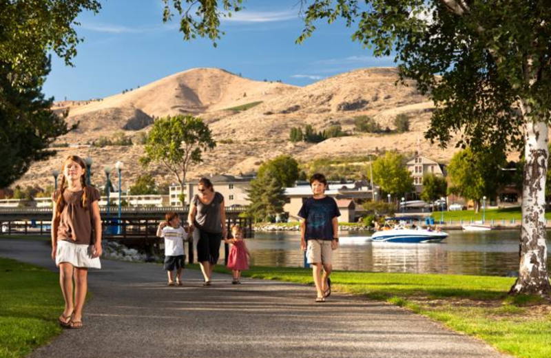 Family walking on trail at Campbell's Resort on Lake Chelan.