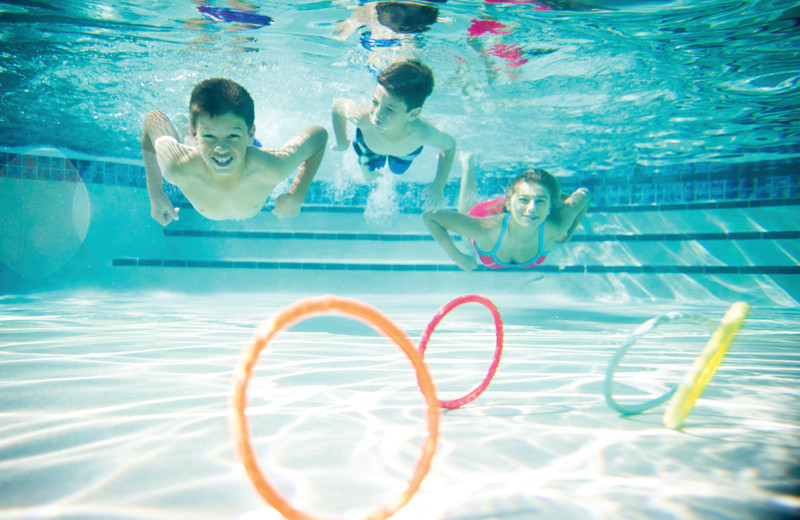 Kids swimming in pool at Holiday Inn Club Vacations at Orange Lake Resort.