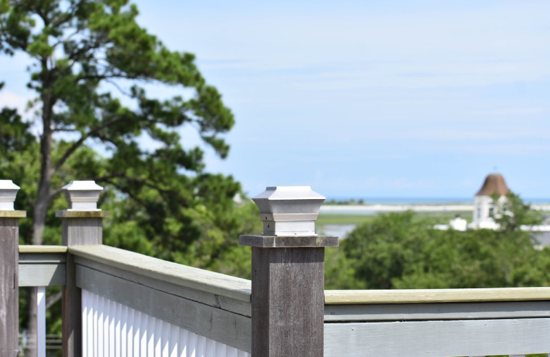 Enjoy a glass of wine and view of the Inlet in the distance from the Widow's Walk rooftop deck with seating area. 