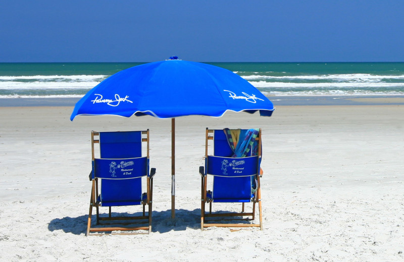 Lounge on the beach at Holiday Isle Oceanfront Resort. 