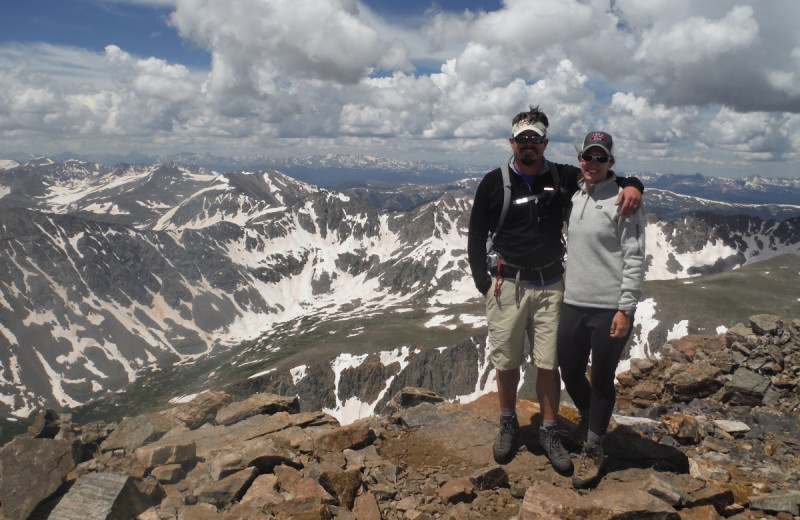 Couple on mountain top at Tumbling River Ranch.