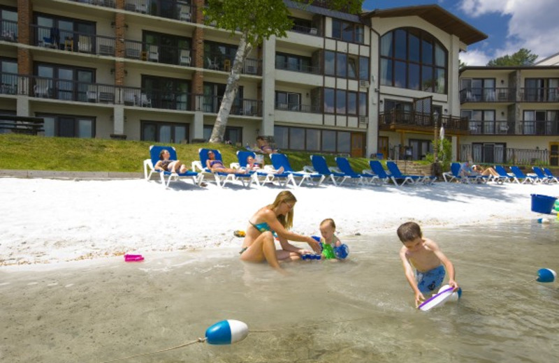 Kids playing at the beach at Golden Arrow Lakeside Resort.