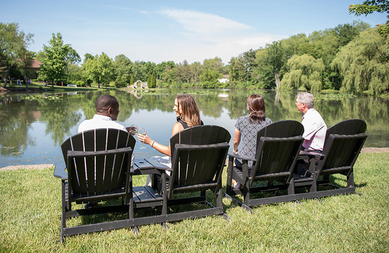 Friends and family sharing a moment by the lake.